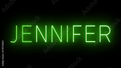 Flickering green retro style neon sign glowing against a black background photo