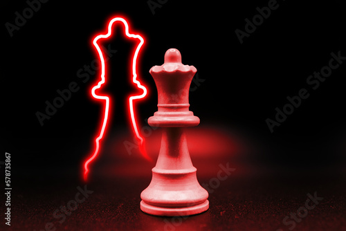 Queen red shape neon led with black background. Illustration of chess pieces