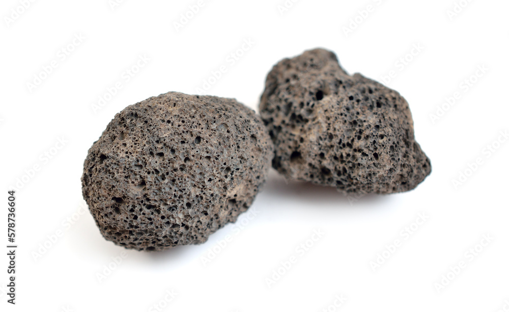 Porous black volcanic rock. Lava stone, pumice stone, or volcanic pumice with distinctive pores Porous black volcanic rock. Lava stone, pumice stone, or volcanic pumice with distinctive pores