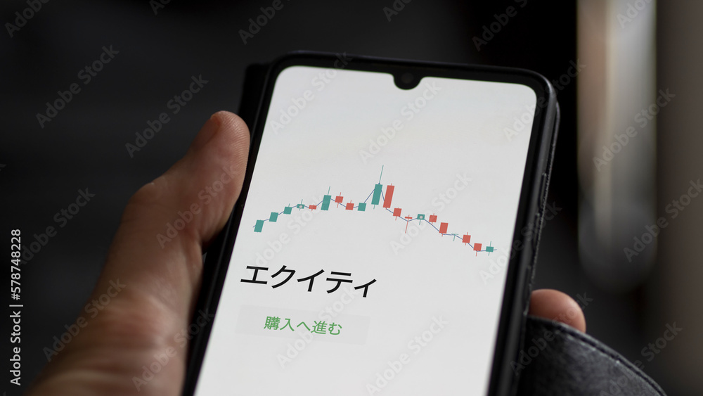 An investor analysing an ETF on a screen. Funds stocks exchange with Japanese text: equity, buy An investor analysing an ETF on a screen. Funds stocks exchange with Japanese text: equity, buy