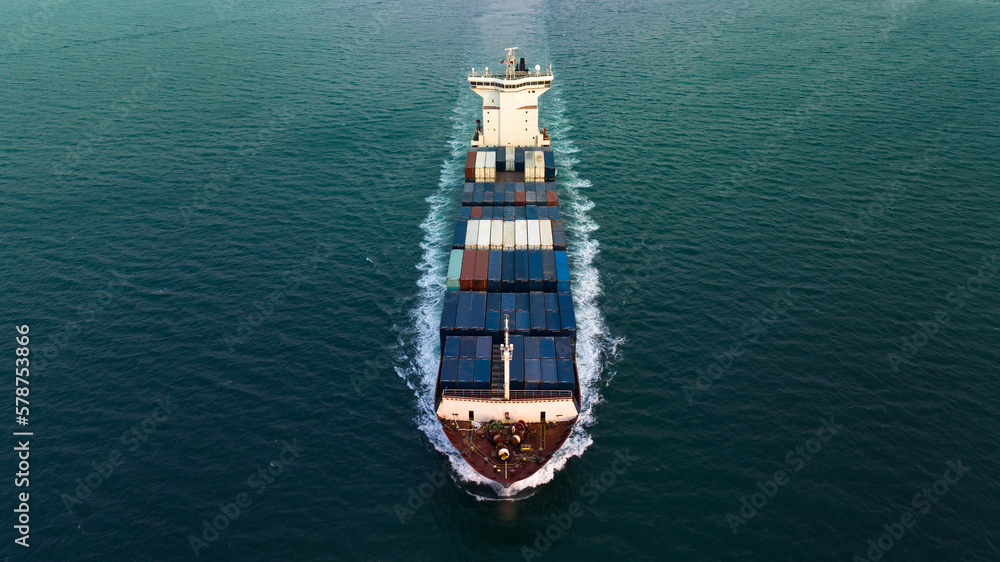 cargo container ship full speed sailing in sea to import export goods of international  and worldwide, by container ship Transport, business and industry delivery service, photograph aerial view .