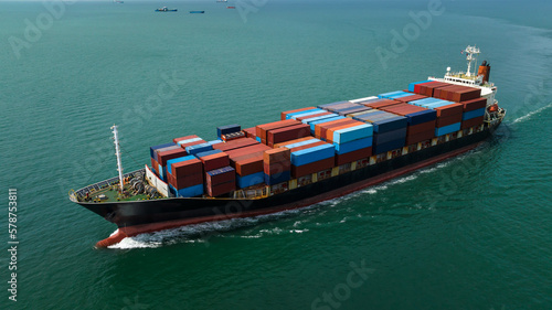 cargo container ship sailing in sea to import export goods and distributing product to dealer and consumers across worldwide, by container ship Transport