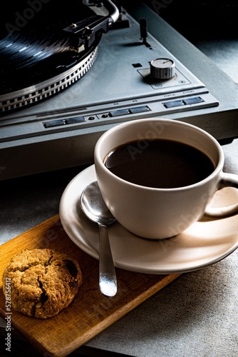 Cup of coffee, vinyl player, and oatmeal cookies. Coffee Jazz.