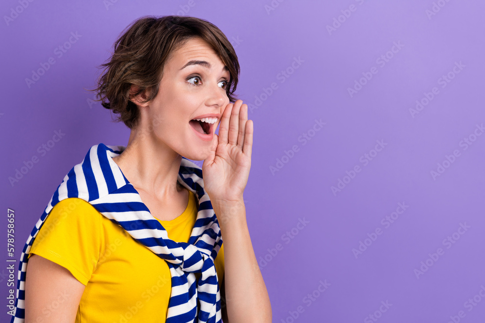 Fototapeta premium Profile side photo of cheerful pretty lady wear trendy striped clothes look empty space share news isolated on purple color background
