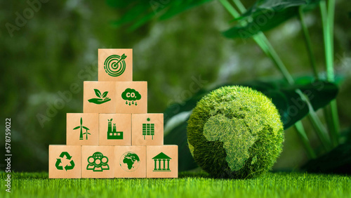 Green earth with the icon of Environment for environmental, social and governance, Reduce CO2 emission,  and Net zero greenhouse gas emissions target. Climate neutral long term strategy.