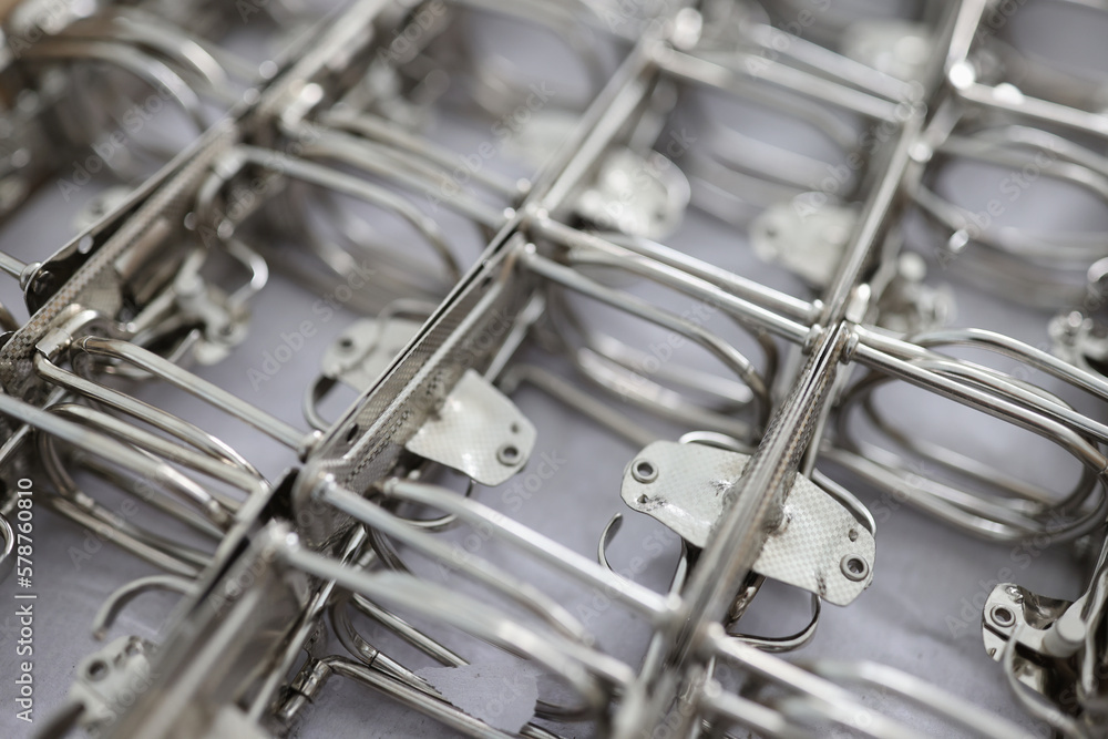 A lot of metal folder fasteners or bindings parts. A lot of metal folder fasteners or bindings parts.
