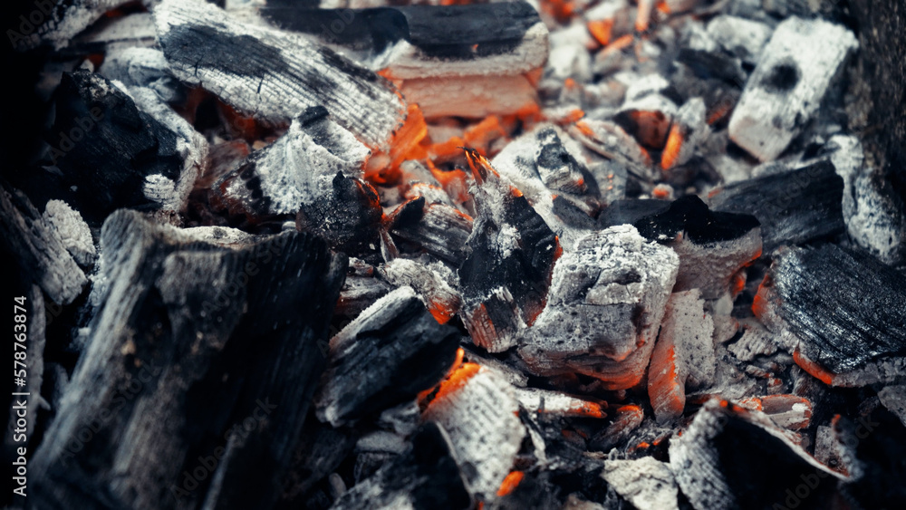 Metal grill with coals. Grilled meat. The fire is smoldering in the grill brazier. Picnic in nature. Coal burns with flame and coal flame on the grill. Burning wooden barbecue on a brazier. Metal grill with coals. Grilled meat. The fire is smoldering in the grill brazier. Picnic in nature. Coal burns with flame and coal flame on the grill. Burning wooden barbecue on a brazier.