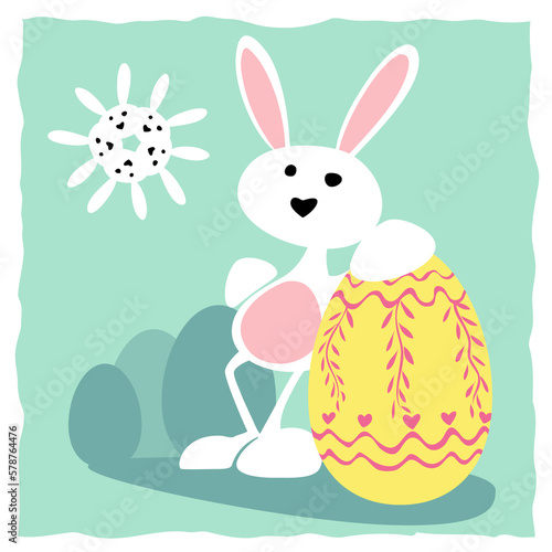 Feliz Pascua (Happy Easter). Un lindo conejo blanco apoyado en un huevo de Pascua decorado con muchos colores, huevos de Pascua al fondo. El día es soleado, con un sol formado por conejos. photo