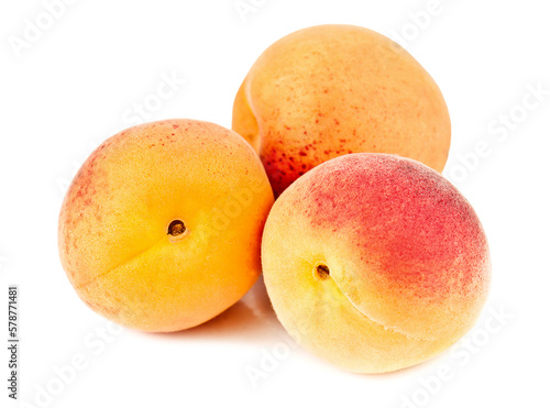 Three ripe apricots on white background