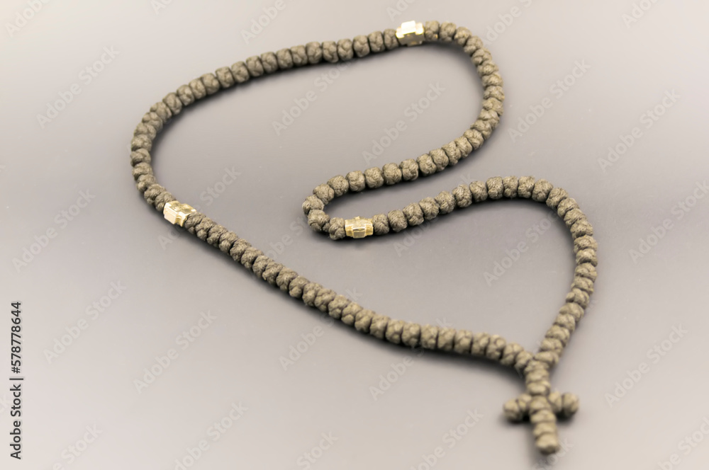 Rosary beads on grey background Rosary beads on grey background