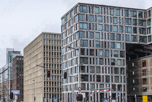 View of high-density residential and business area on the banks of the IJ River at the Oostelijke Handelskade (Eastern Docklands). Amsterdam, The Netherlands. 