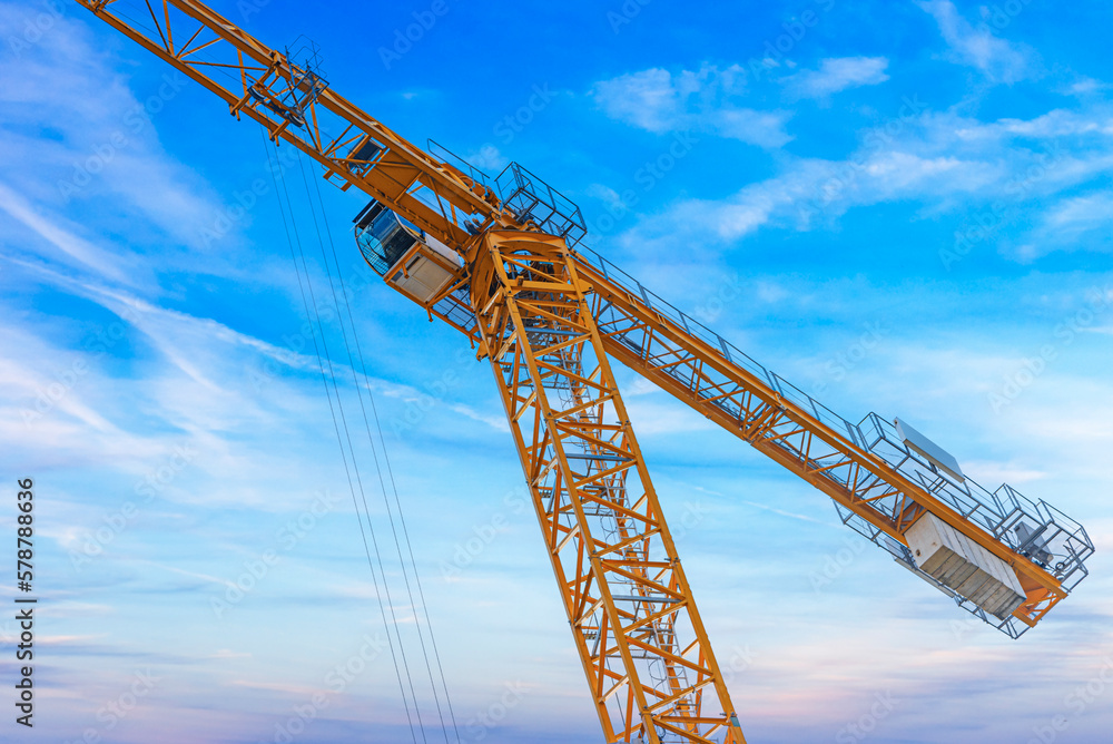 Construction tower crane against the blue sky. Construction tower crane against the blue sky.