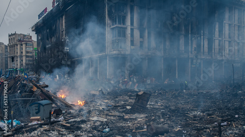 Burned building and barricades at the Maidan square in Kyiv, Ukraine during anti government protests in 2014	
 photo
