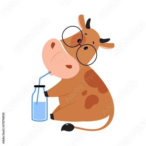 Cute happy brown cow in glasses drinking milk. Lovely farm animal character holding glass bottle with straw cartoon vector illustration