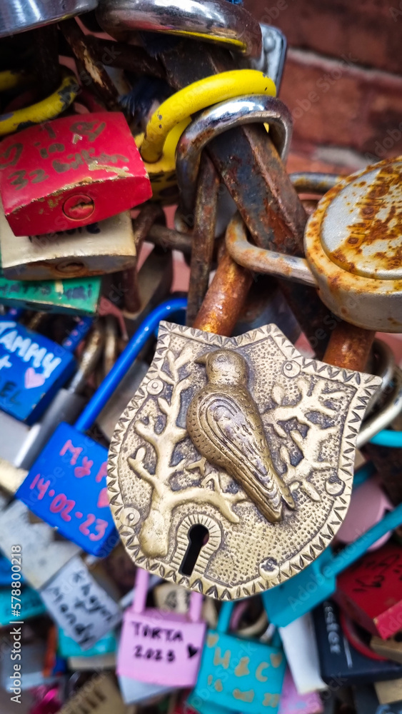 Original metal lock with a bird ornament
