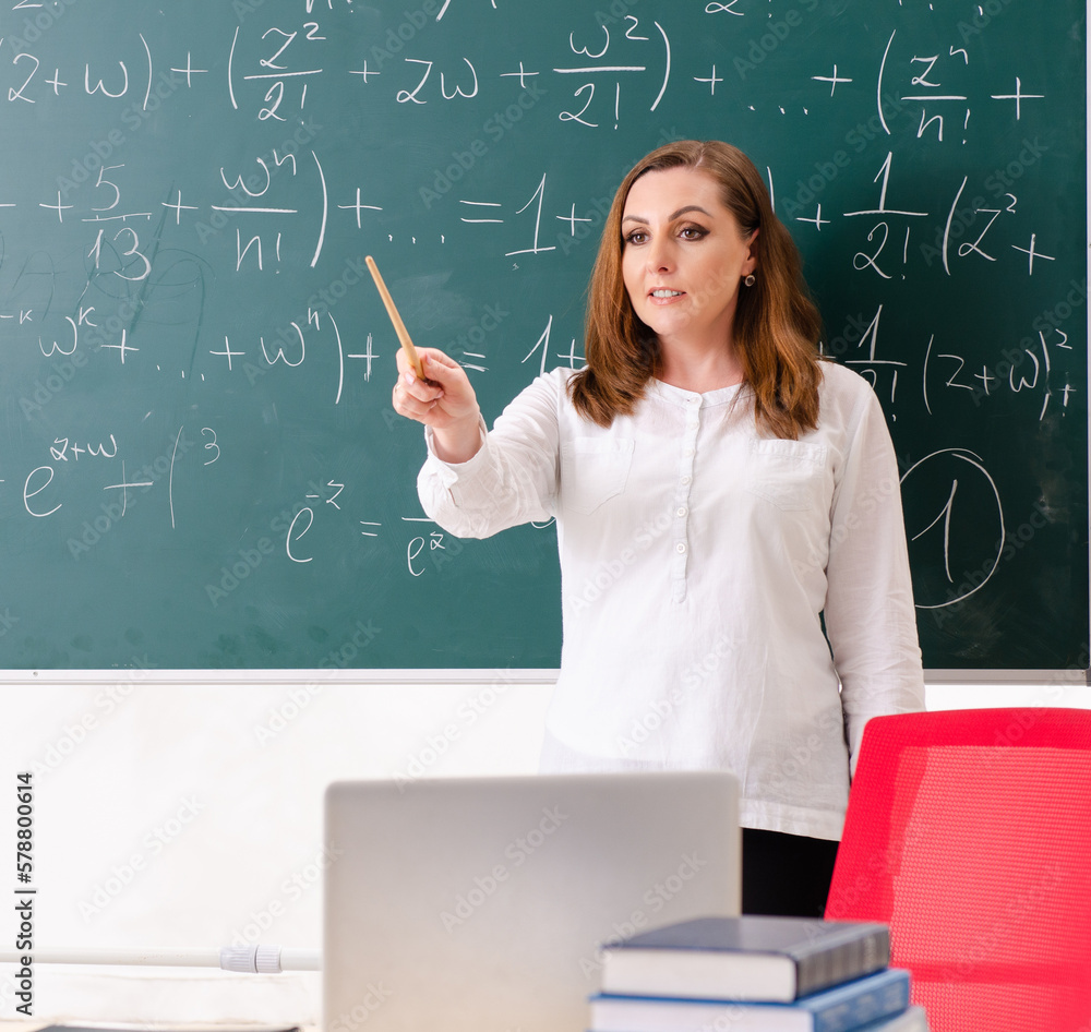 Female math teacher in the classroom Female math teacher in the classroom