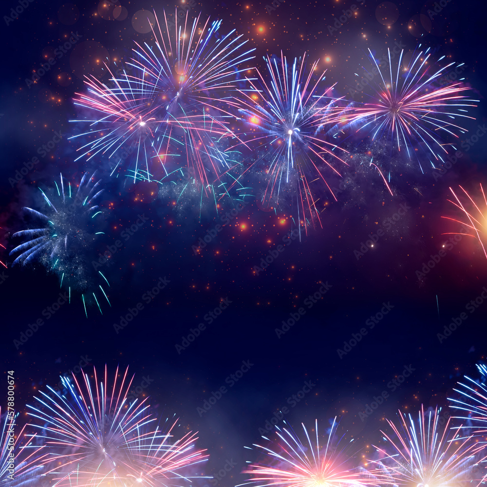 Fototapeta premium Beautiful blue and pink fireworks display lights up the sky with dazzling display during New Year celebration. Abstract colored fireworks background, copy space. Celebration and anniversary concept