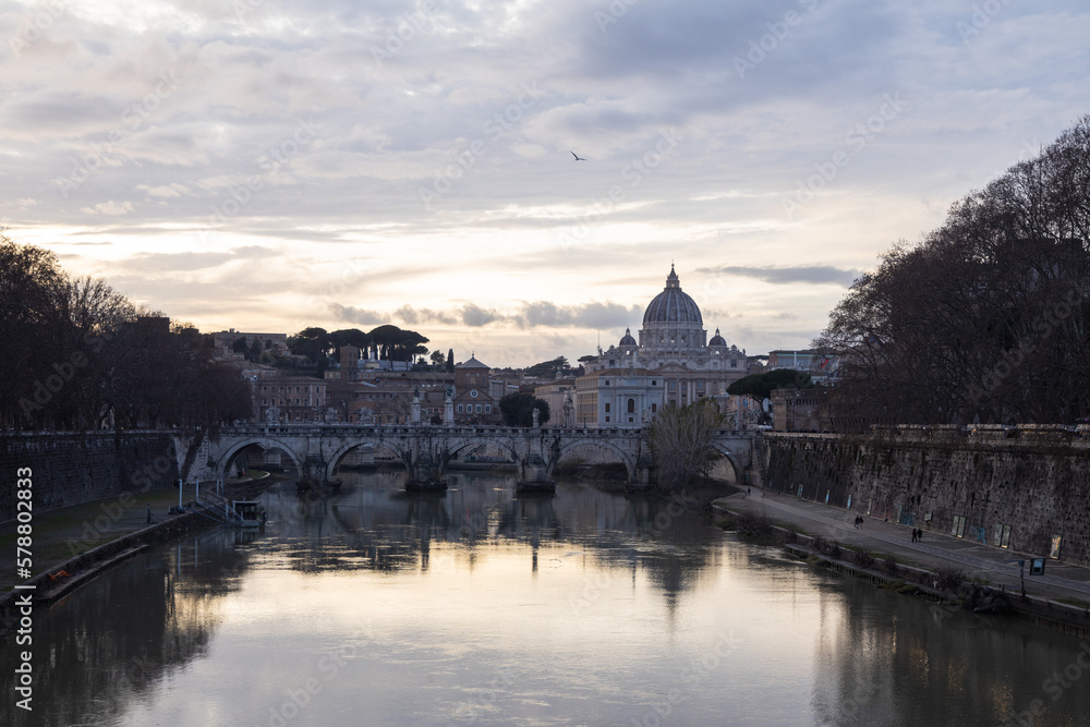 Sunset view on river tiber with St. Peter Basilic in Rome, Italy