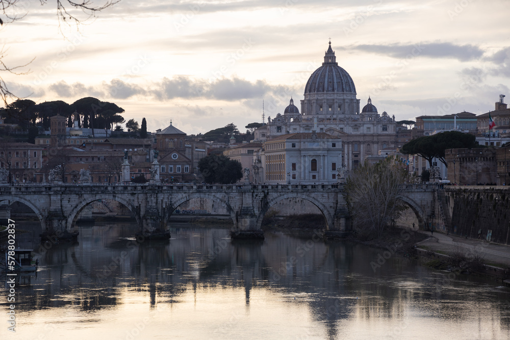 Sunset view on river tiber with St. Peter Basilic in Rome, Italy