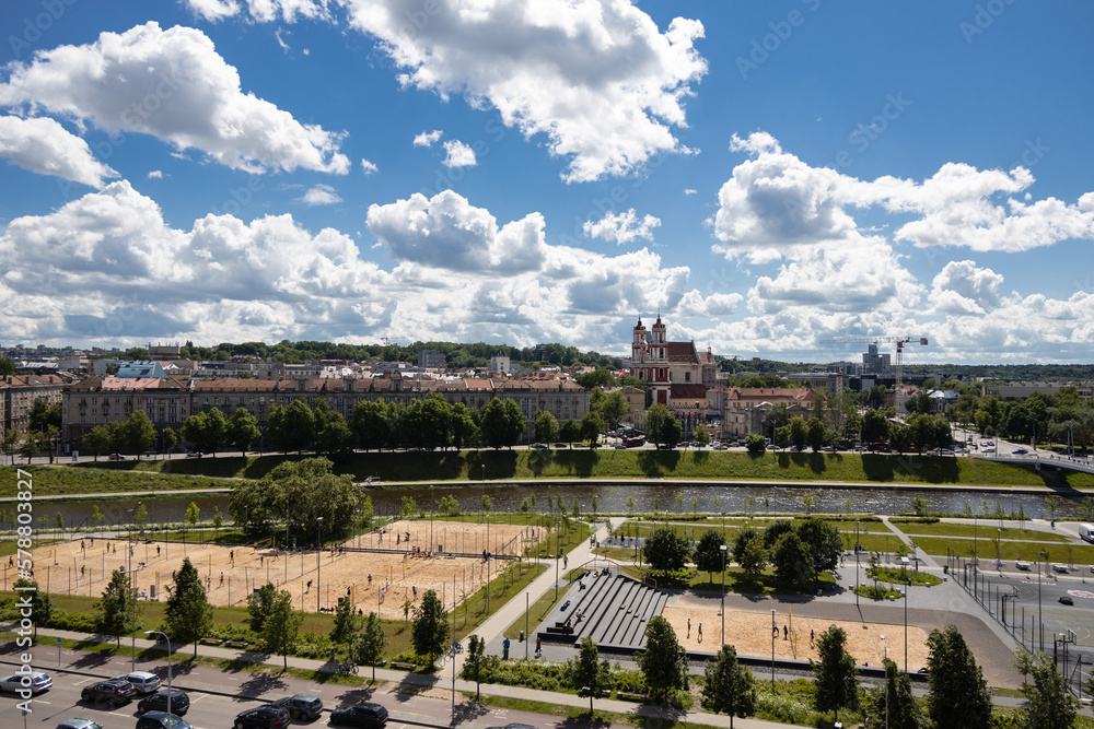 Fototapeta premium Top view of Vilnius center near white bridge at summer, beach volleyball courts