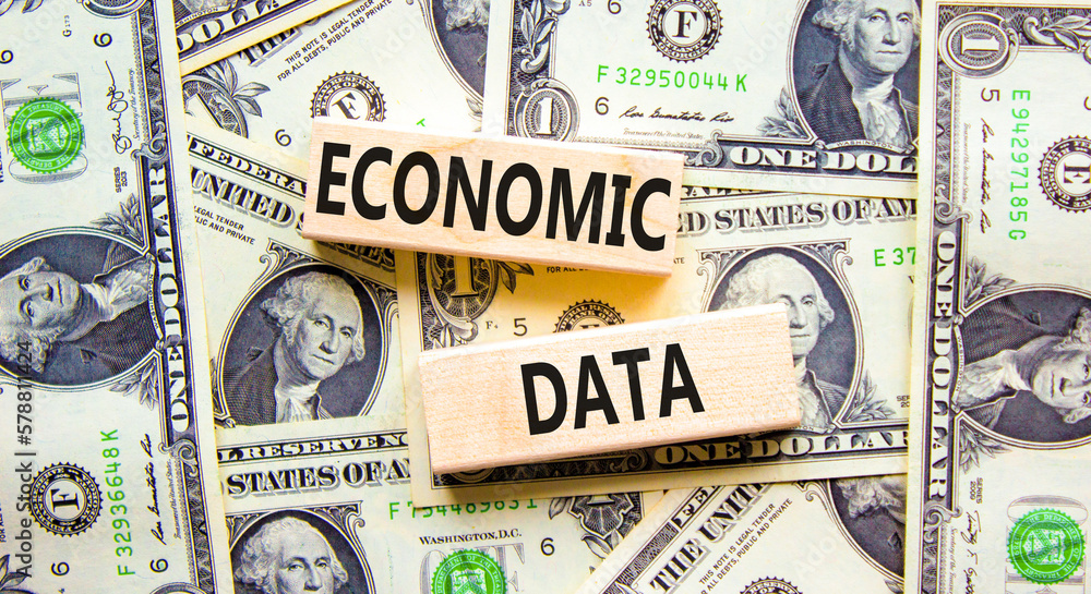 Economic data symbol. Concept words Economic data on wooden block. Beautiful background from dollar bills. Dollar bills. Business economic data concept. Copy space.