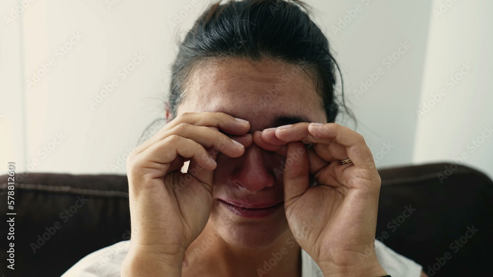 Fototapeta premium A desperate woman suffering from mental breakdown. Troubled 30s female person in distress. Depressed emotion feeling hopeless