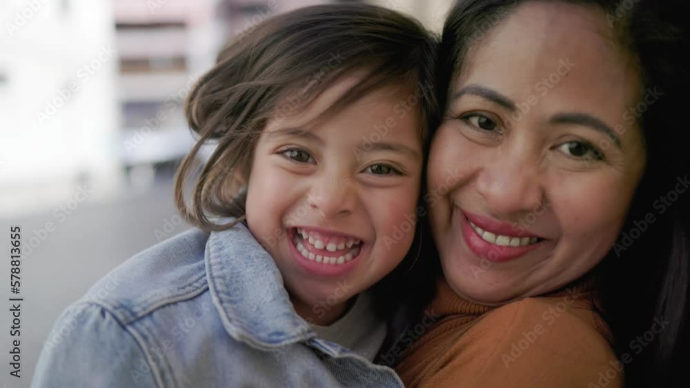 Asian family: Happy daughter and mother having tender moment together outdoor Asian family: Happy daughter and mother having tender moment together outdoor