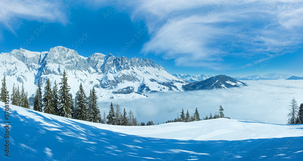 Morning winter mountain landscape with clouds in below valley (Hochkoenig region, Austria)