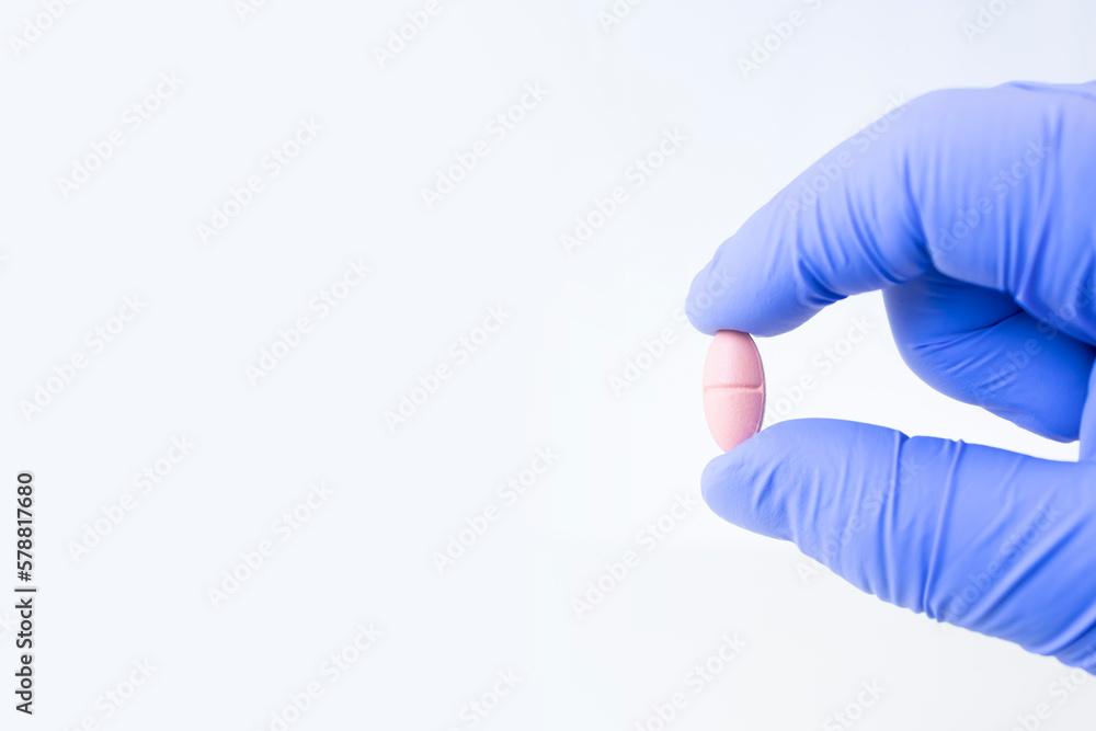 Diet. Nutrition. Healthy eating, lifestyle. Vitamin D, E, A in capsule. Prescription medical concept. Pharmacist. The hand holds the pill. Isolated Diet. Nutrition. Healthy eating, lifestyle. Vitamin D, E, A in capsule. Prescription medical concept. Pharmacist. The hand holds the pill. Isolated