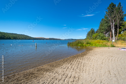 The sandy shoreline at the public Liberty Lake State Park on a summer day in Liberty Lake  a suburb of Spokane  Washington  USA.