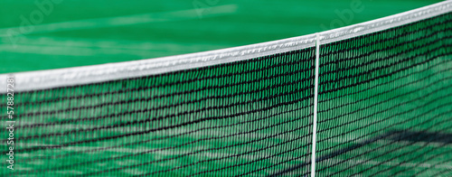 Green paddle tennis net and hard court. Horizontal sport theme poster, greeting cards, headers, website and app