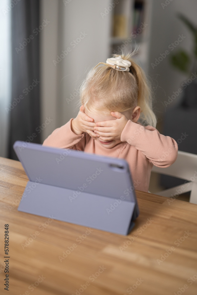 Deaf child girl with cochlear implant studying to hear sounds - recovery after cochlear Implant surgery and rehabilitation concept Deaf child girl with cochlear implant studying to hear sounds - recovery after cochlear Implant surgery and rehabilitation concept