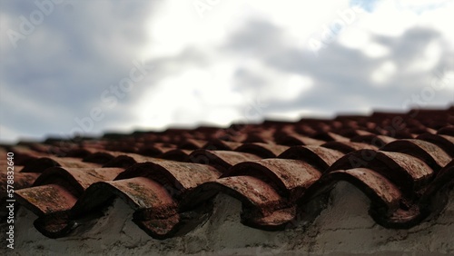 tile roof against cloudy sky