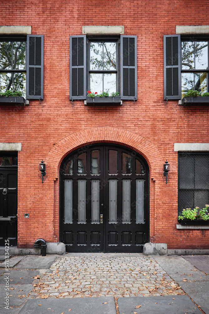 a beautiful brownstone building on an iconic street of Manhattan, NYC. a beautiful brownstone building on an iconic street of Manhattan, NYC.