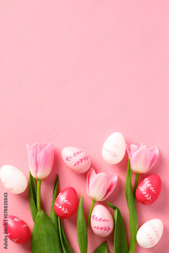 Happy Easter holiday concept. Vertical banner design with tulips and Easter eggs on pink background. Flat lay, top view.