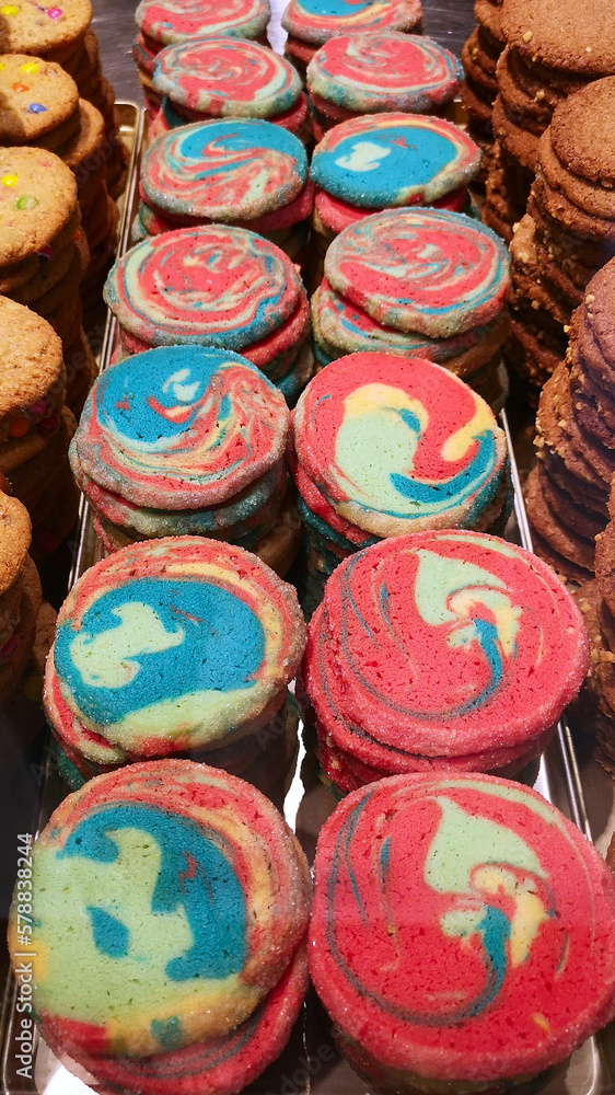 Rainbow colored cookies on display in local bakery in Germany. Red Dye 40 was found to be not safe.