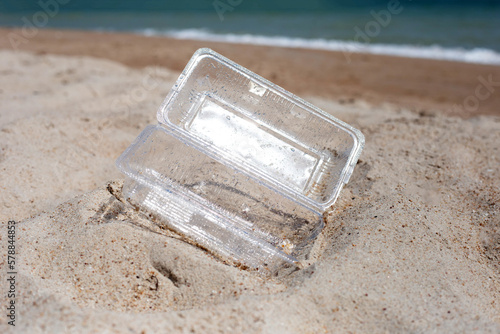 Plastic food container on the beach © Bowonpat