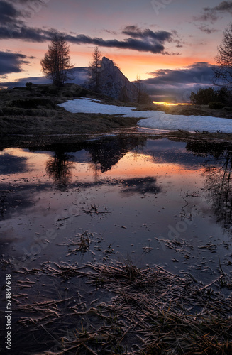 Mount Sass de Stria reflecting in a pond at sunset in Cortina d Ampezzo  Italy