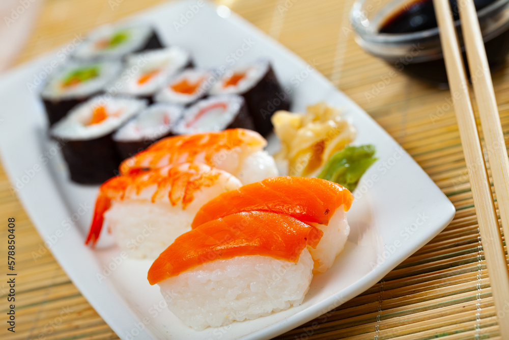 Various of nigiri and hosomaki sushi traditionally served with wasabi and soy sauce. High quality photo