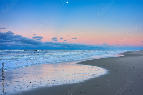 Beautiful Baltic sea beach on the Hel Peninsula at sunset. Poland