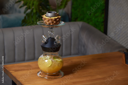 Stylish hookah with the aroma pineapple for relax.Pineapple shisha.Hookah lounge. photo