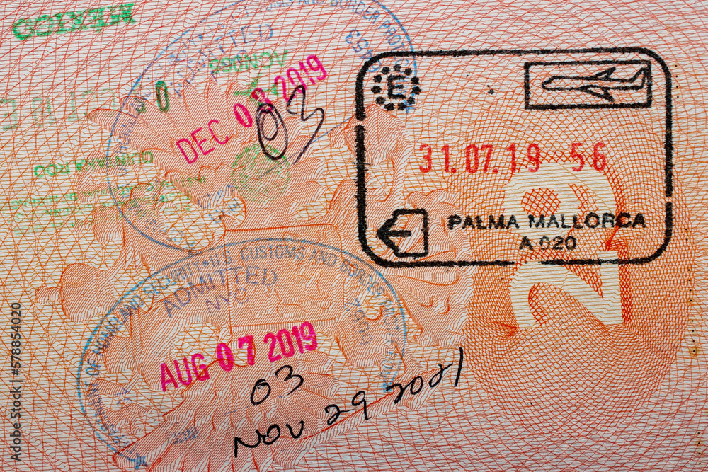 Stamps in a travel passport, entry and exit stamp, emigration, immigration, tourism concept