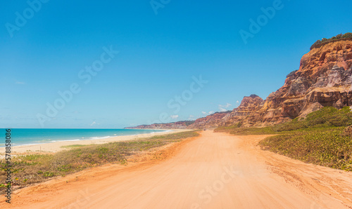 View of paradise beach and canyons in Brazil. Beautiful landscape of deserted beach. Vista da praia paradisíaca e cânions no Brasil. Bela paisagem de praia deserta photo