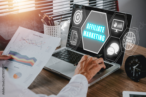 Affiliate marketing concept, Business person analyzing financial data on laptop computer with affiliate marketing icon on virtual screen, Digital Marketing content planning advertising strategy. photo