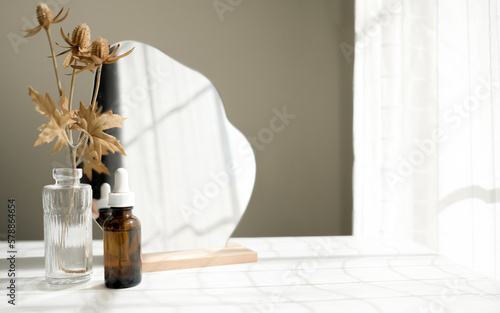 skin care bottle with mirror and flower for beauty and skincare routine , self-care concept.