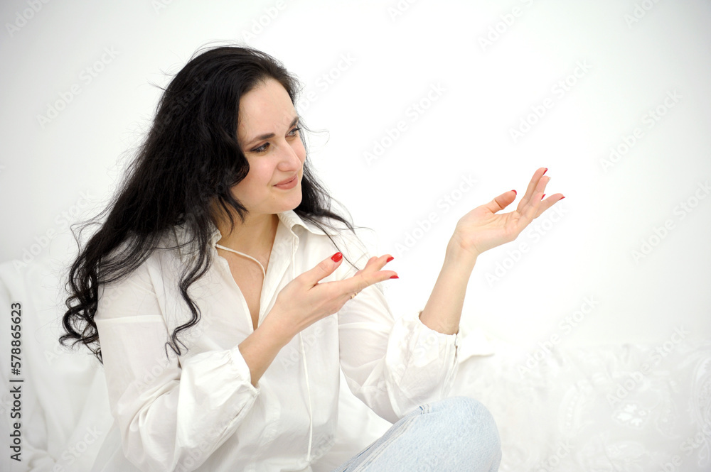 beautiful middle-aged woman shows hands on a white background empty space for your advertising white shirt tenderness emotions advertising close background fickford banner beautiful middle-aged woman shows hands on a white background empty space for your advertising white shirt tenderness emotions advertising close background fickford banner