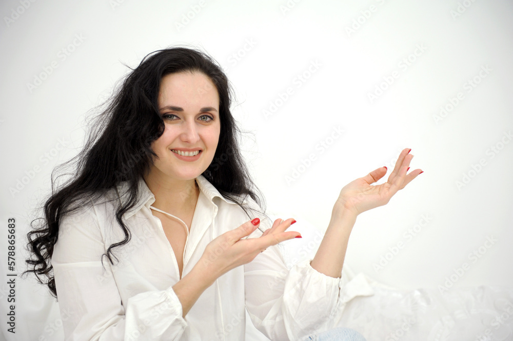 beautiful middle-aged woman shows hands on a white background empty space for your advertising white shirt tenderness emotions advertising close background fickford banner beautiful middle-aged woman shows hands on a white background empty space for your advertising white shirt tenderness emotions advertising close background fickford banner