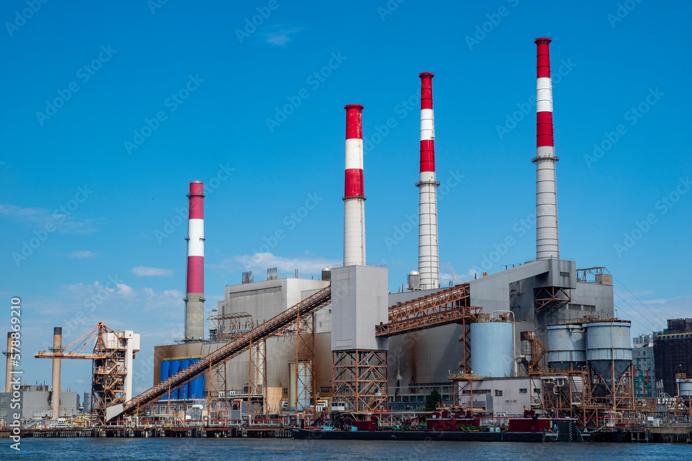 Factory with smoke stacks along Hudson River NYC Factory with smoke stacks along Hudson River NYC