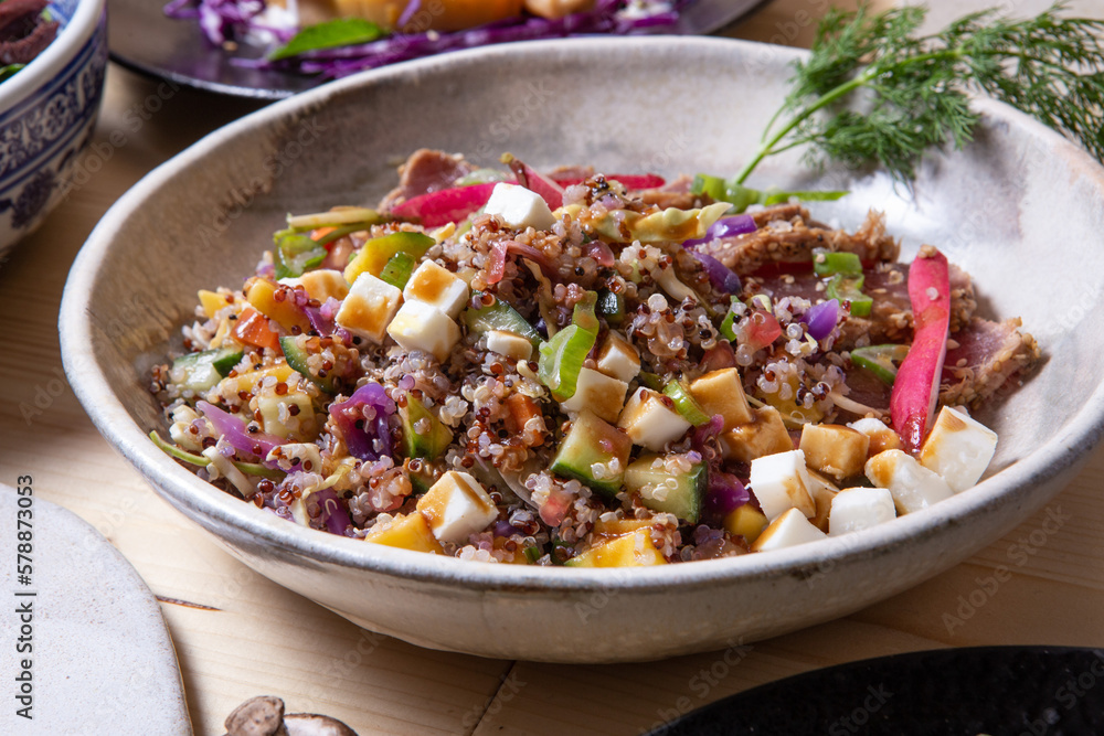 Plate with quinoa and fried tuna slices