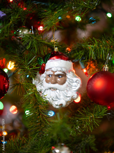 santa claus decorating christmas tree